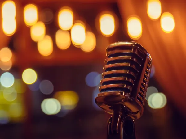 Mic on a stage with a blurred background behind