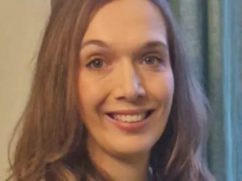 Close up of woman's face with long brown hair 